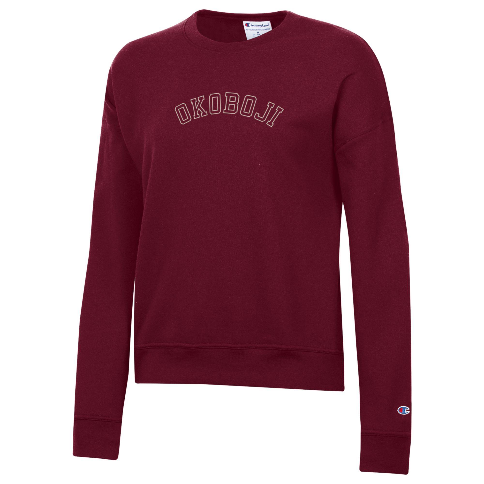 Maroon Champion womens Powerblend crewneck sweatshirt with outlined arched OKOBOJI chest graphic